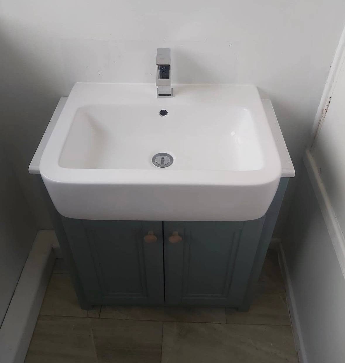 New basin and grey vanity unit with a chrome mixer tap